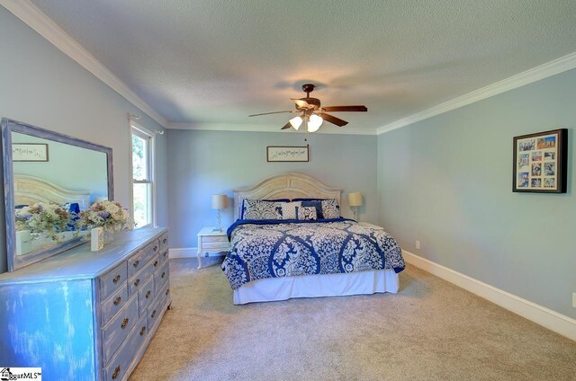 carpeted bedroom featuring ceiling fan, crown molding, and a textured ceiling