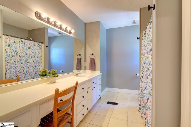 bathroom featuring tile patterned floors and vanity