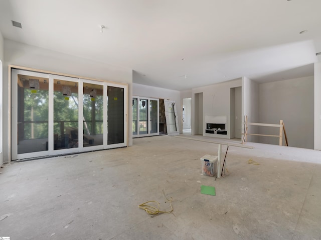 unfurnished living room with a fireplace