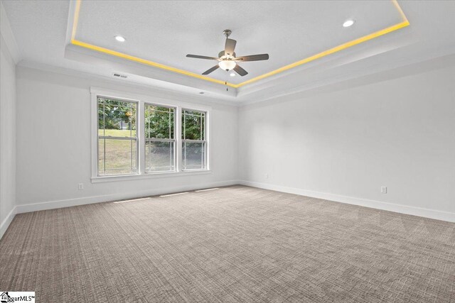 18 Double Crest Dr Lot 5, Taylors, SC 29685 - carpeted spare room featuring ceiling fan, crown molding, and a raised ceiling