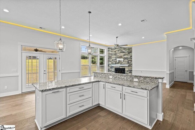 18 Double Crest Dr Lot 5, Taylors, SC 29685 - kitchen featuring pendant lighting, a large fireplace, hardwood / wood-style flooring, ceiling fan, and white cabinets