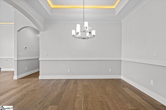 18 Double Crest Dr Lot 5, Taylors, SC 29685 - unfurnished dining area featuring hardwood / wood-style floors, ornamental molding, an inviting chandelier, and a tray ceiling