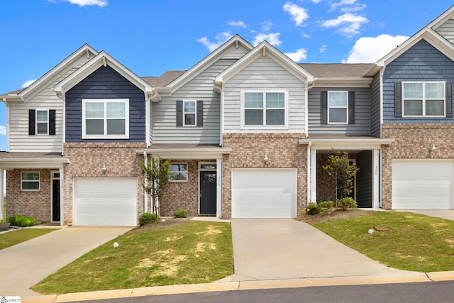 townhome / multi-family property featuring a garage