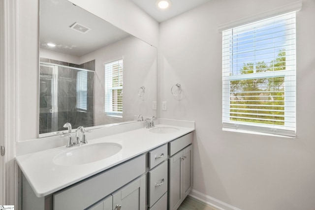 bathroom with dual bowl vanity