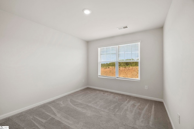 empty room featuring carpet flooring