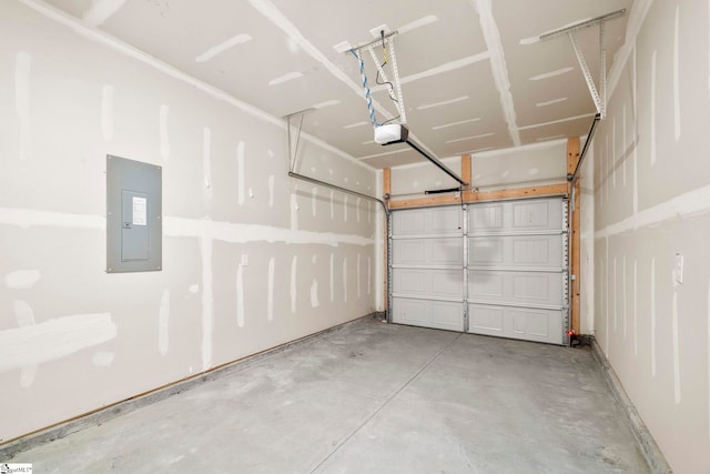 garage with a garage door opener and electric panel