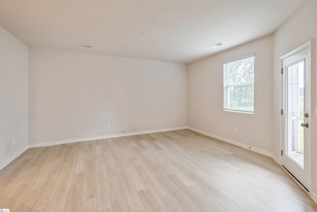 spare room with light wood-type flooring