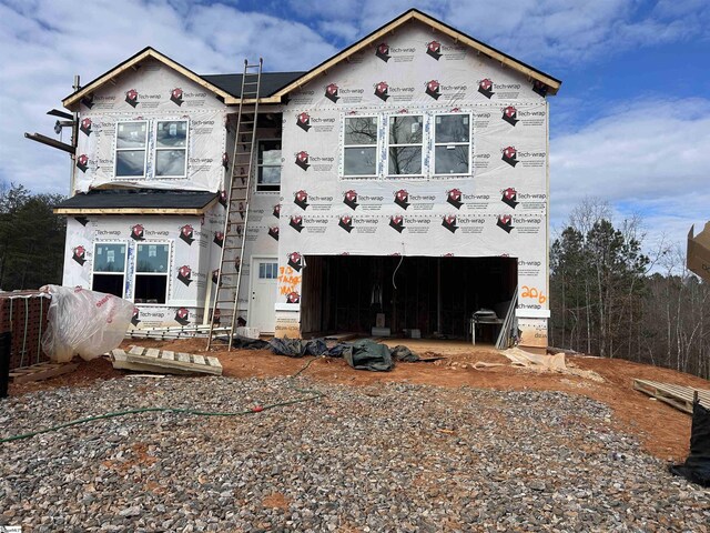 view of front of house featuring a lawn and a garage