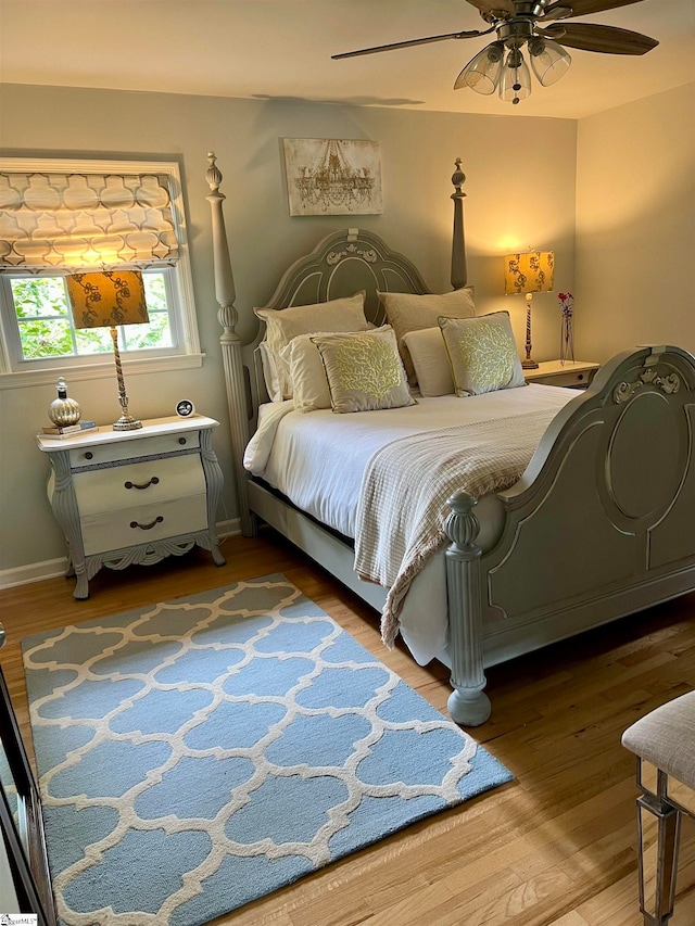 bedroom featuring hardwood / wood-style floors and ceiling fan