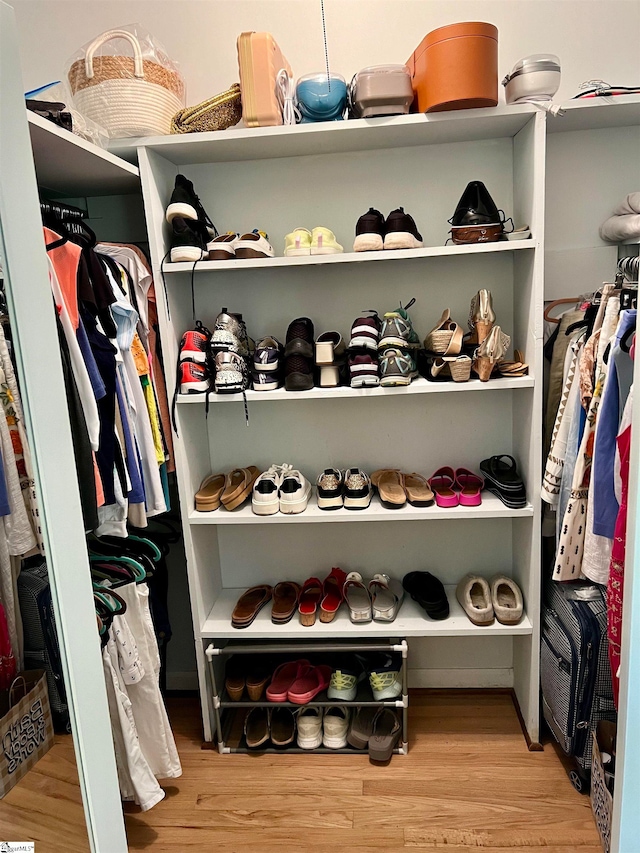 spacious closet featuring light hardwood / wood-style flooring