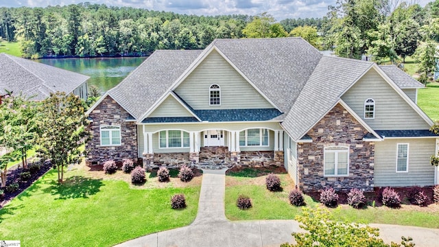 craftsman house with a front lawn