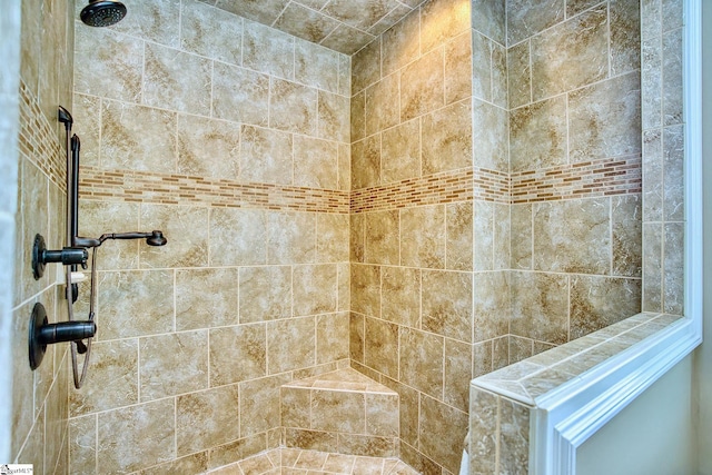 bathroom featuring tiled shower