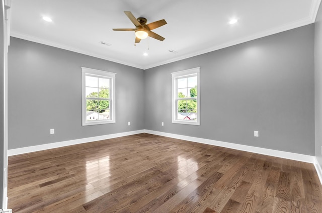 unfurnished room featuring baseboards, visible vents, ornamental molding, and a healthy amount of sunlight