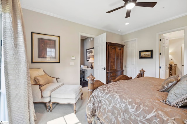 bedroom featuring ensuite bathroom, crown molding, carpet flooring, and ceiling fan