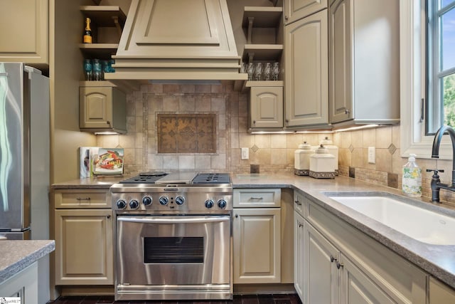 kitchen with appliances with stainless steel finishes, tasteful backsplash, and sink