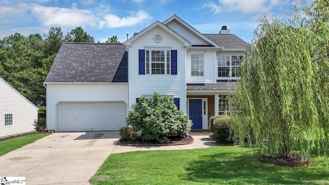 view of front facade featuring a front yard and a garage