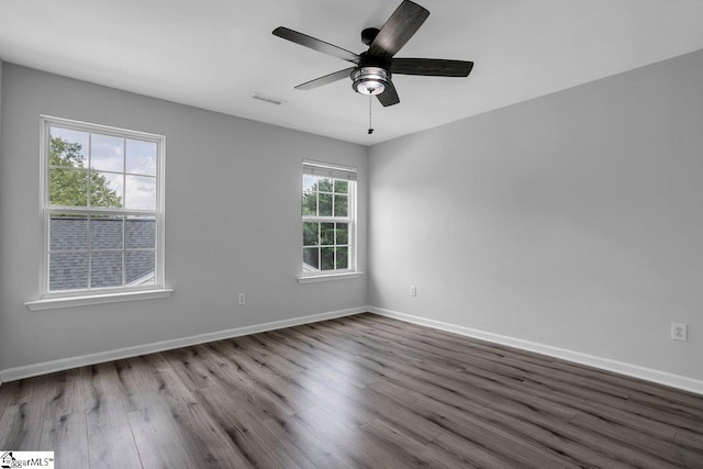 empty room featuring hardwood / wood-style floors and ceiling fan