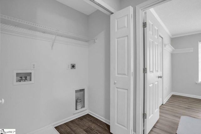 laundry room with a textured ceiling, washer hookup, hardwood / wood-style floors, and electric dryer hookup