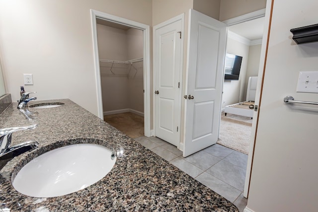 bathroom with vanity, tile patterned floors, and crown molding