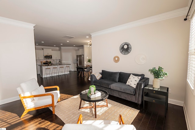 living room featuring ornamental molding and dark hardwood / wood-style flooring