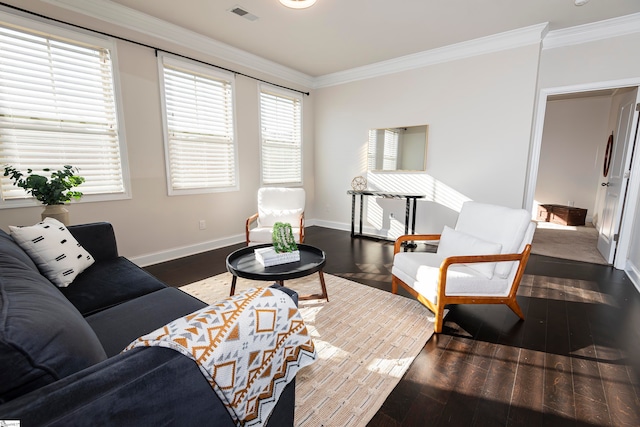 living room with ornamental molding, plenty of natural light, and dark wood-type flooring