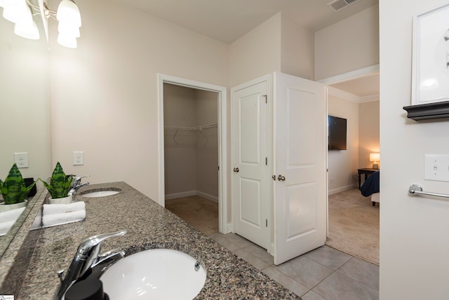 bathroom with vanity and tile patterned floors