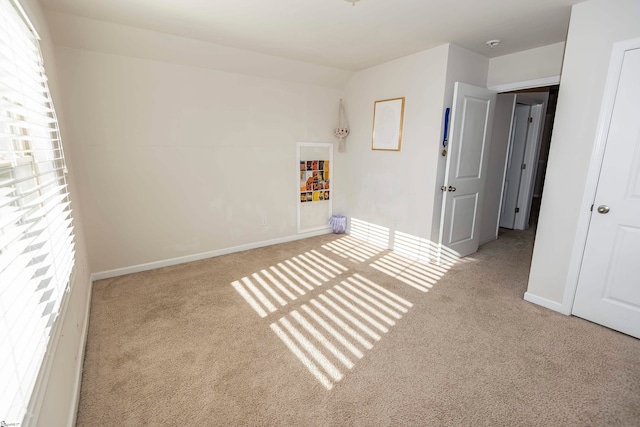 unfurnished bedroom featuring light carpet