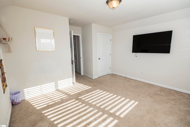 unfurnished bedroom featuring light colored carpet