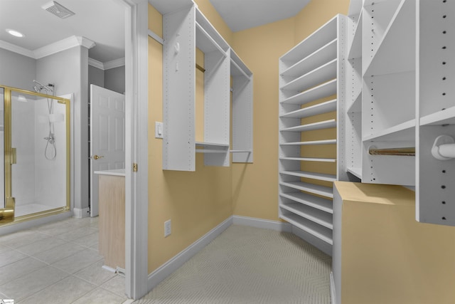 spacious closet featuring tile patterned flooring and visible vents