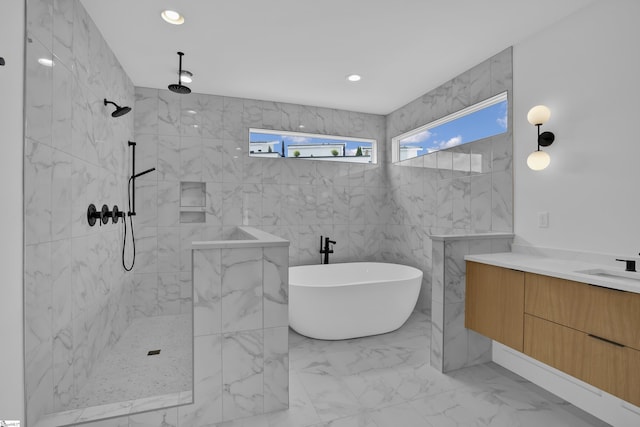 bathroom featuring vanity and plus walk in shower