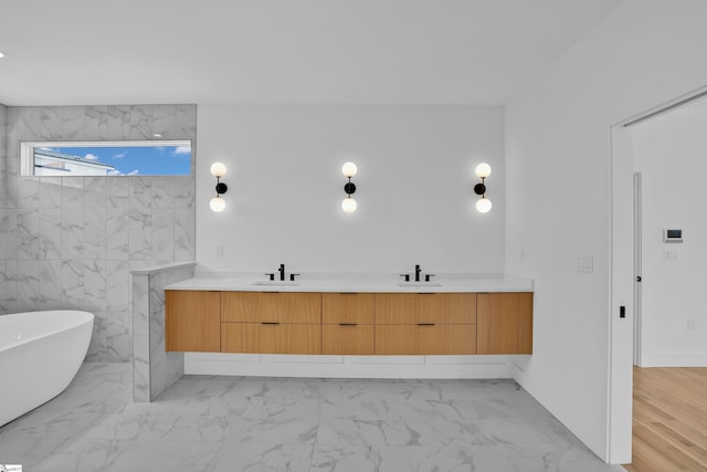 bathroom featuring sink, tile walls, a bathing tub, and wood-type flooring