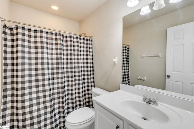 bathroom with toilet and vanity