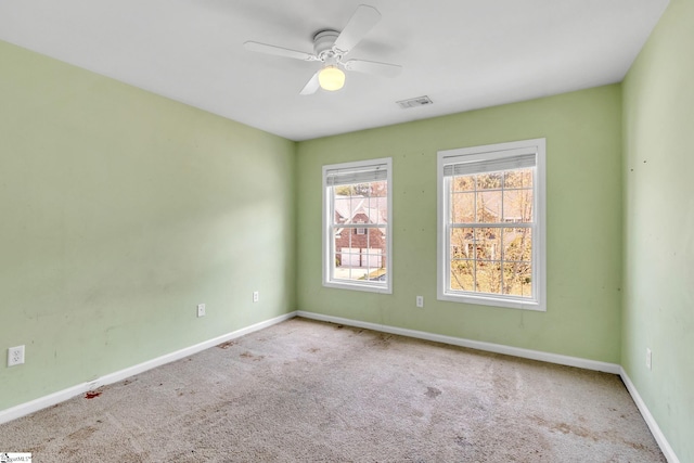 carpeted empty room with ceiling fan