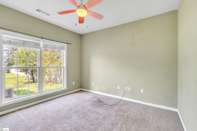 empty room with carpet floors and ceiling fan