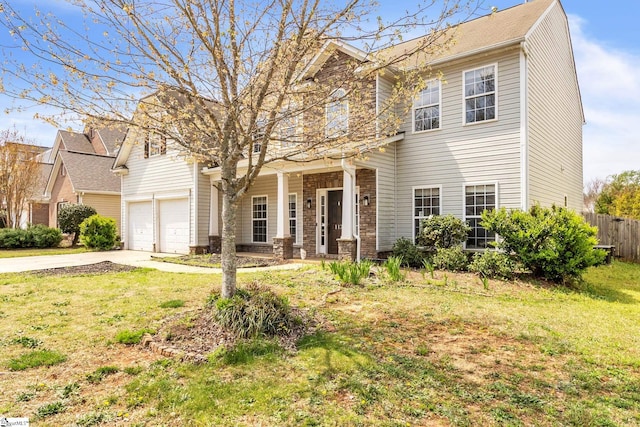 view of front facade with a front yard and a garage