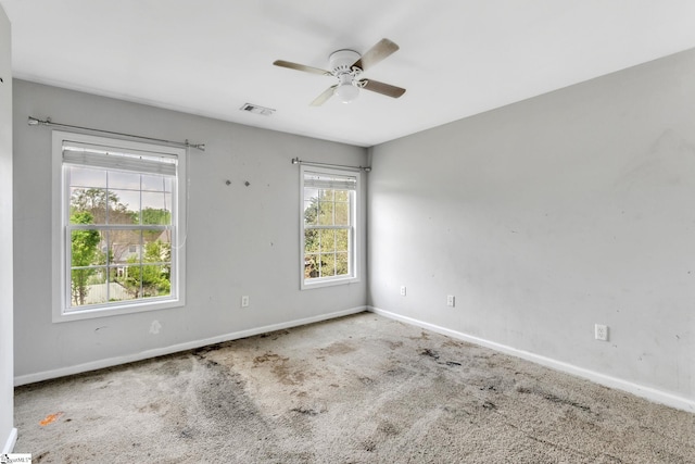 carpeted empty room with ceiling fan