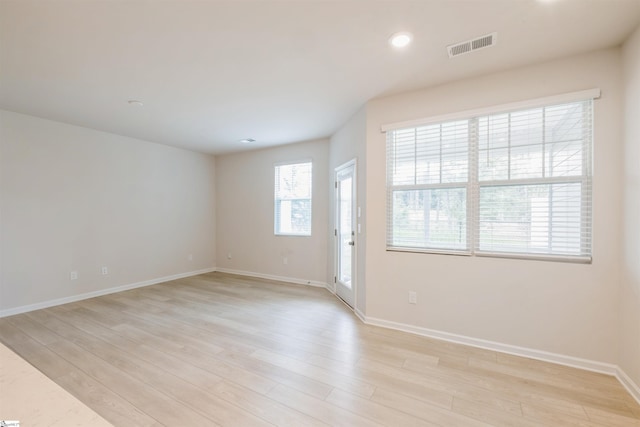 unfurnished room featuring light wood-type flooring