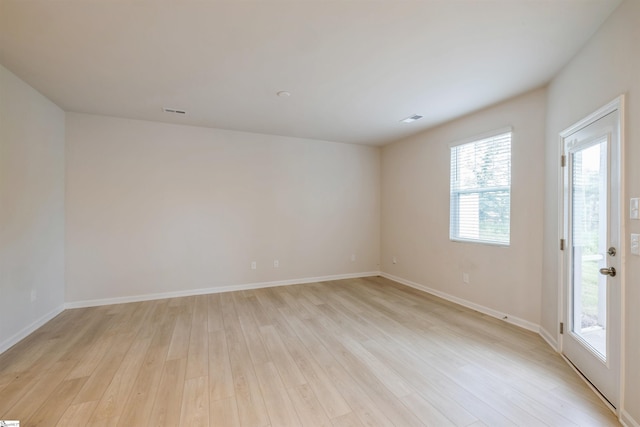 empty room with light wood-type flooring