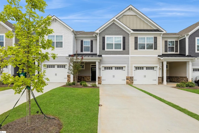 view of front facade with a garage and a front lawn