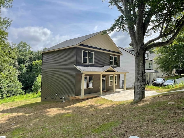 view of front of home with a front lawn and a porch