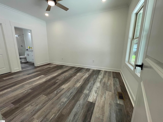 spare room featuring ceiling fan, crown molding, and dark hardwood / wood-style floors