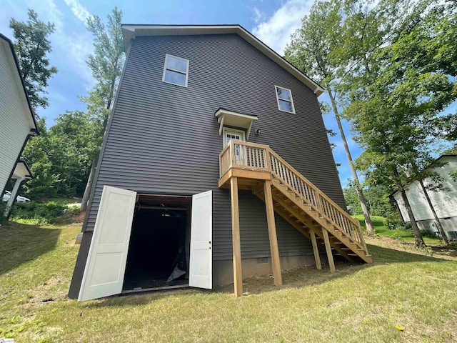 rear view of house with a lawn