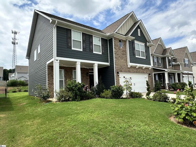 craftsman-style home with a garage and a front yard