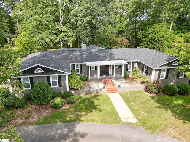 ranch-style house featuring a front lawn