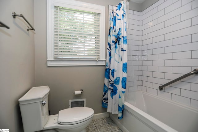 bathroom with toilet, shower / bath combo, and tile patterned floors