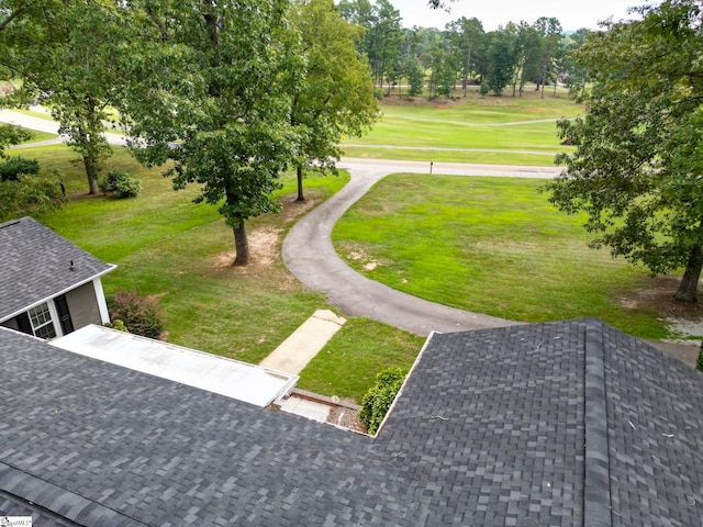 view of home's community featuring a lawn