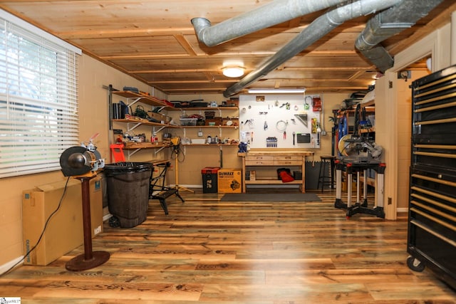 office area featuring wooden ceiling, a workshop area, and hardwood / wood-style floors