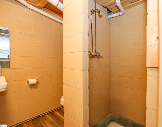 bathroom with hardwood / wood-style flooring, wooden ceiling, and toilet