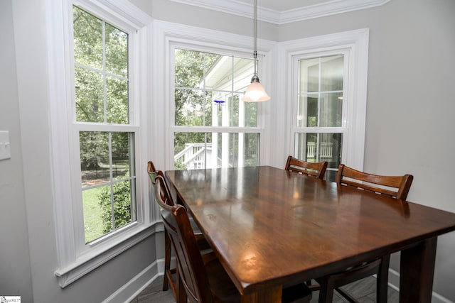 dining area featuring crown molding