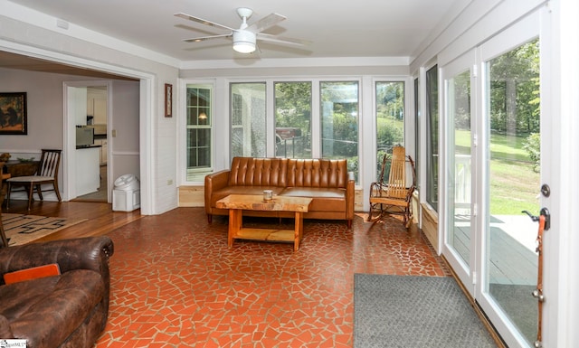 sunroom featuring plenty of natural light and ceiling fan